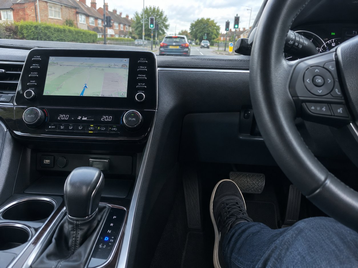 Automatic car creeping forward slowly at a junction in Nottingham traffic