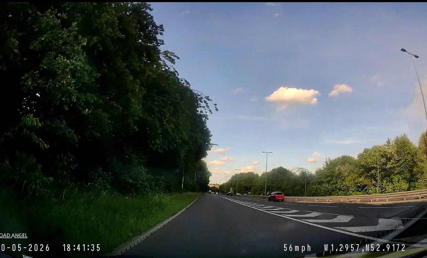 A car's view of a dual carriageway slip road ready to merge with traffic