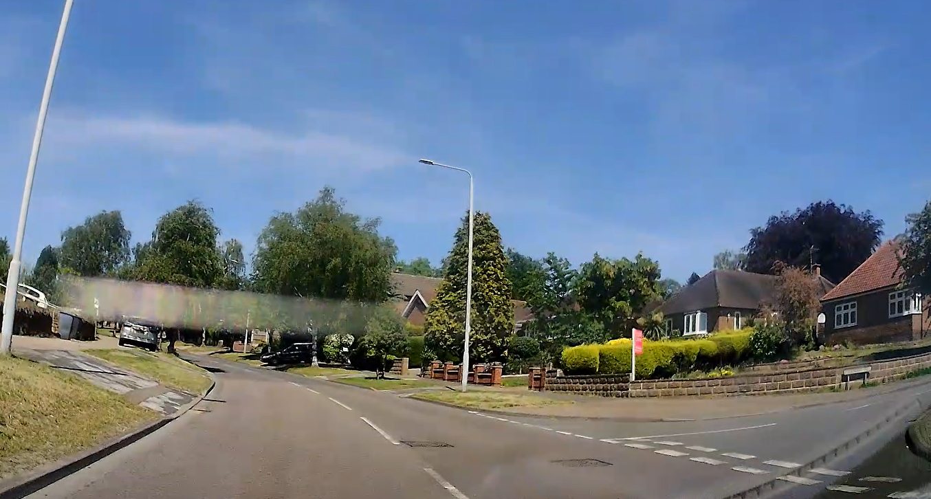 Automatic car positioned to turn right at a junction in Nottingham